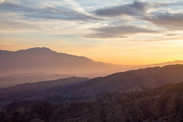 Colorful sky above a desert mountain landscape scene in California