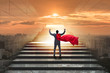 © Elnur - Businessman superhero successful in career ladder concept
