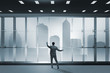 © Elnur - Businessman in front of office window thinking of new challenges