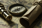 Fototapeta Mapy - Retro compass with old map and spyglass