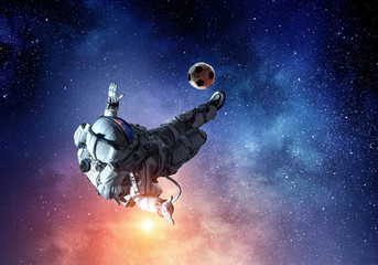Wall Mural - Astronaut play soccer game