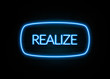 Realize  - colorful Neon Sign on brickwall