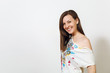 © ViDi Studio - Beautiful European young happy brown-haired woman with healthy clean skin, dressed in casual light clothes looking at camera with shy charming smile, on a white background. Emotions concept.