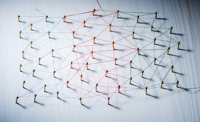 Background. Abstract concept of network, social media, internet, teamwork, communication. Nails linked together by threads.