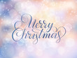 © Olga Prozorova - Merry Christmas text. Holiday greetings quote. Blurred winter background with falling snow effect