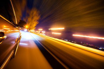 Wall Mural - Car on the road with motion blur background.