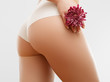 © looking2thesky - Women health and intimate hygiene. Beautiful Woman's body with smooth soft skin with flower. Epilation Concepts
