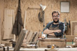 © 1001color - Wood designer working in workshop.