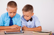 © dmitriisimakov - boys learn lessons Internet Tablet