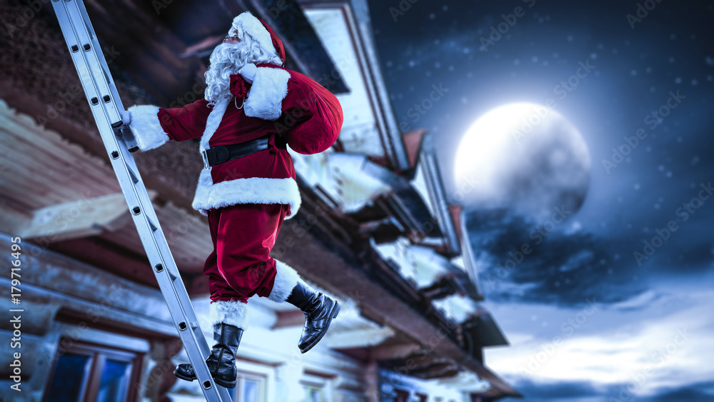 Santa Straddle Santa Claus straddles the ladder. The magical vigiline night. The sky ...