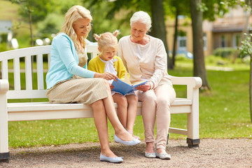 Canvas Print - woman with daughter and senior mother at park