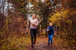 © maryviolet - Little boy and his sister running in autumn forest