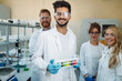 © NDABCREATIVITY - Group of young successful scientists posing for camera