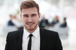© ASDF - successful businessman on blurred background.