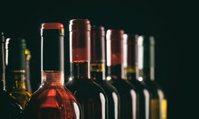 Wine Bottles On Black Background, Copy Space