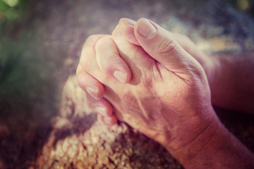 Hands folded in prayer