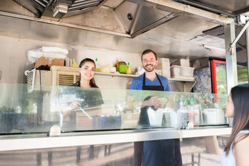 Wall Mural - Food truck owners cooking