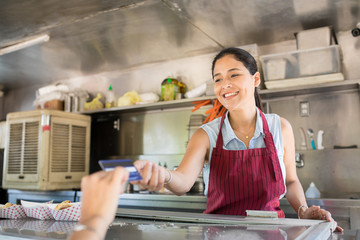 Food truck owner receiving payment