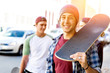 © Sergey Nivens - Teenager boy walking at the street with his skateboard