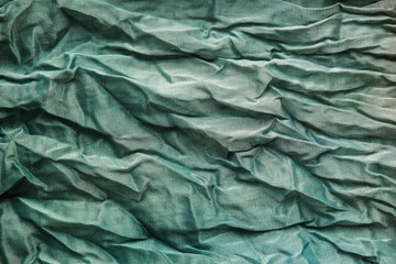 The texture of the mint pleated fabric. Green georgette fabrics.