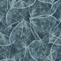 Wall Mural - seamless background from light cyan leaves