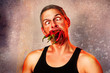 ridiculous expression of a man with hot chillies in his mouth
