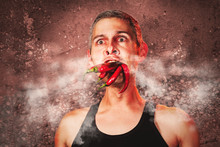 Ridiculous Expression Of A Man With Hot Chillies In His Mouth