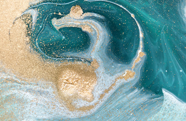 Wall Mural - Marbled green abstract background with golden sequins. Liquid marble ink pattern.