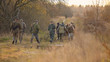 group of hunters in forest