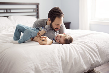 Father and son in bed, happy time on bed