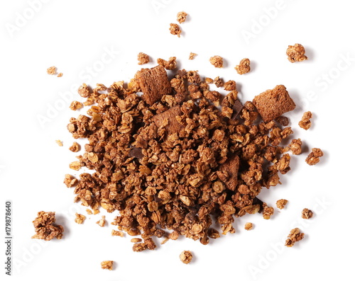 Fotografía Crunchy granola, muesli pile with chocolate isolated on white background, top vi