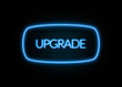 Upgrade  - colorful Neon Sign on brickwall