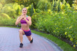 © Africa Studio - Sporty young woman exercising in park