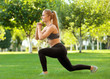 © Africa Studio - Sporty young woman exercising in park