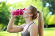 © Africa Studio - Sporty young woman drinking water in park