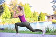 © Africa Studio - Sporty young woman exercising on riverside