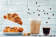 Different types of coffee with flying croissants. Espresso and mocha coffee