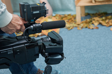 Wall Mural - Video camera operator working with his equipment