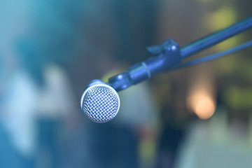 Sticker - Microphone on abstract blurred hall lights.