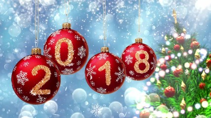 Wall Mural - red balls with numbers 2018 hanging on the background of a blue bokeh and a rotating christmas tree 