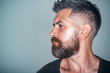 Macho with bearded face profile and stylish hair
