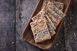 Crunchy crispbread on a wooden background. Healthy snack: cereal crunchy multigrain cereal flax seed ,sesame, sunflower seeds protein bread bar.