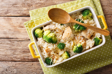 Poster - Dietary foods: rice baked with broccoli, chicken and cheese close-up. Horizontal top view