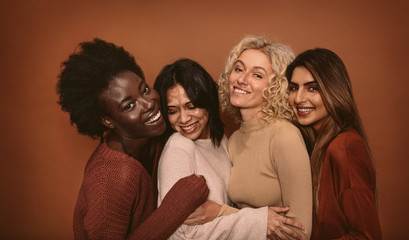 Wall Mural - group of cheerful young women standing together