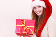 © Voyagerix - Woman holding gift box. Christmas time