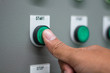 © ekkaluck - The hand pressing 'start' switch on control board