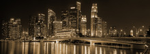Singapore Night Downtown Skyline Panorama. Labels And Trademarks Blured