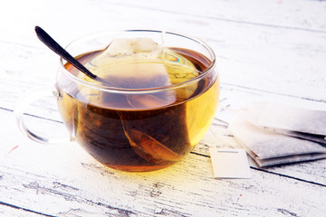 Cup of hot tea with teabag. Cup is from clear glass