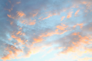 orange clouds against the blue sky