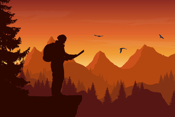 Wall Mural - Vector illustration of a mountain landscape with a forest and birds and a tourist holding a map, under an orange sky